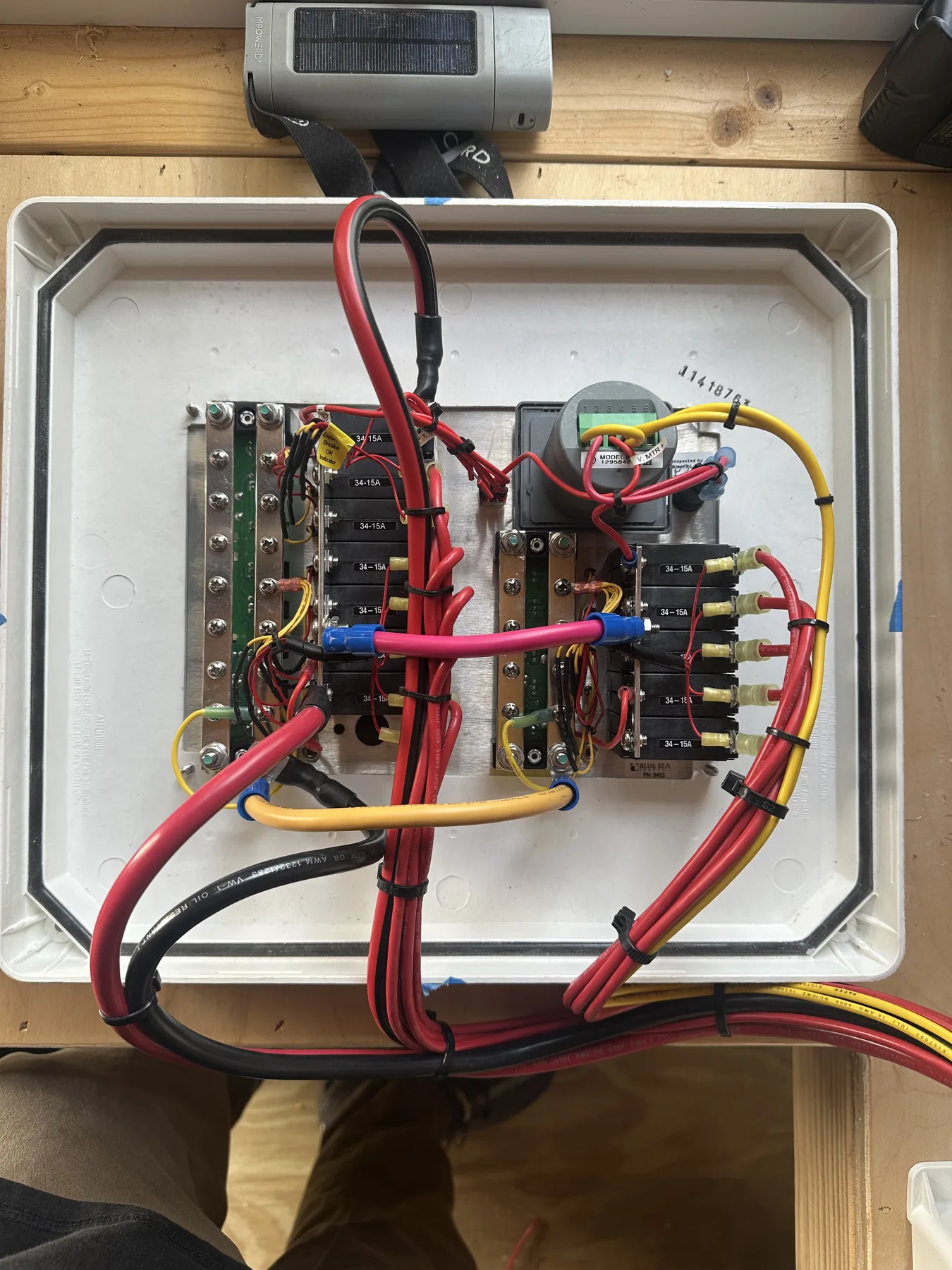 Organized DC circuit breaker panel and bus bars wired into an enclosure