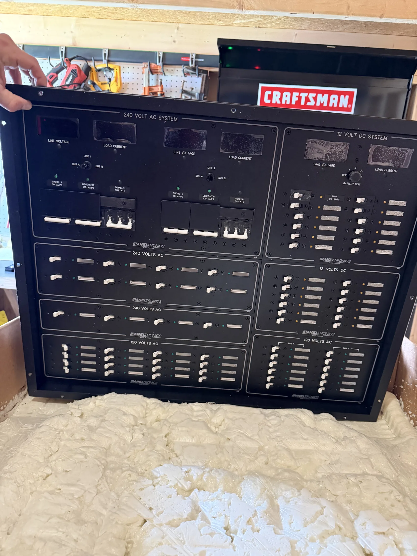 A custom 240V AC and 12V DC distribution panel, built and bench-tested before installation