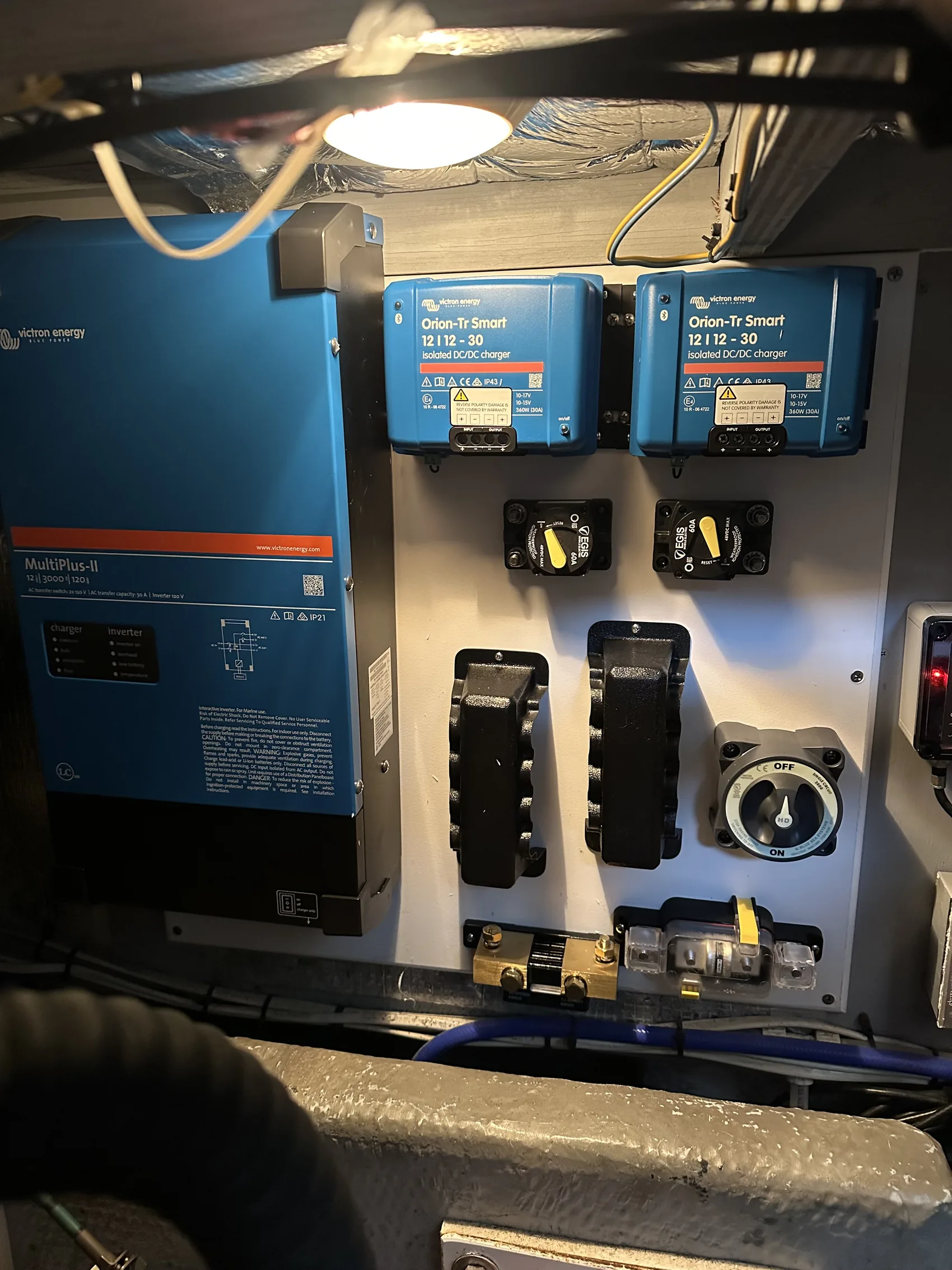 Victron inverter, MPPT solar controllers, and DC-DC charger installed as an integrated off-grid power system